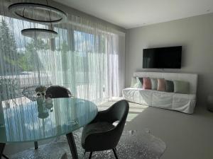 TV a/nebo společenská místnost v ubytování Eva's Appartement + 7 fotografií