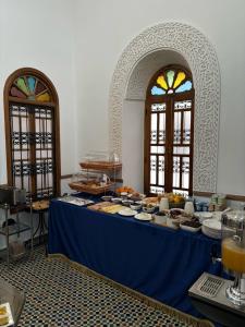 a blue table with food on top at Dar Al Miraaj in Rabat