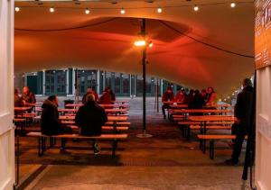 een groep mensen op banken in een gebouw bij Rotheram (Suite) at Bicester Heritage in Bicester +5 foto's