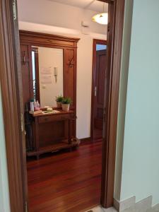 a hallway with a door leading into a room at APARTAMENTO LA GRANJA EN GAMA(next to Santoña) in Gama