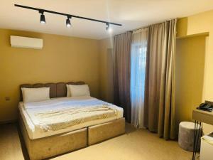 Postel nebo postele na pokoji v ubytování Dastan Hotel Baku