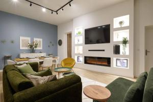 TV a/nebo společenská místnost v ubytování Le Viennet by Paul Riquet 1609 Residences