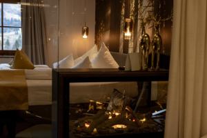 A bed or beds in a room at Boutique Hotel Mandarfnerhof