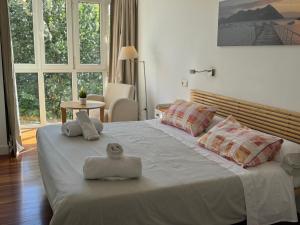 Ένα ή περισσότερα κρεβάτια σε δωμάτιο στο Apartamento PioXII Center +39 φωτογραφίες