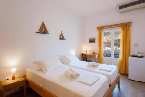 A bed or beds in a room at Margado