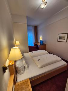 Cama ou camas em um quarto em Hotel Beethoven