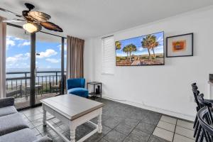 a living room with a view of the ocean at Meridian Plaza 404 in Myrtle Beach