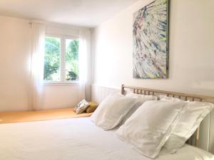 Cama ou camas em um quarto em L’appartement - Jardin Secret