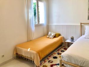 Cama ou camas em um quarto em L’appartement - Jardin Secret