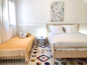Cama ou camas em um quarto em L’appartement - Jardin Secret