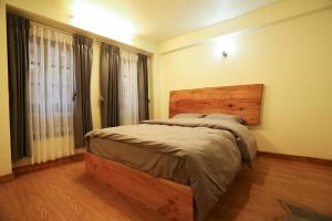 Postel nebo postele na pokoji v ubytování Lumwoh Guest House + 19 fotografií