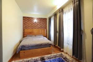 Katil atau katil-katil dalam bilik di Lumwoh Guest House