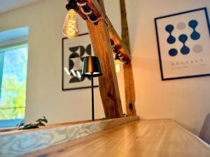 a lamp sitting on top of a table in a room at Suburban Loft in Bochum +46 photos