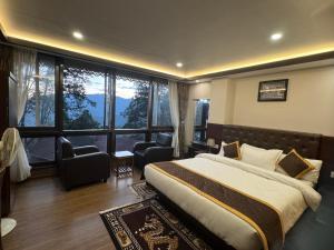Ένα ή περισσότερα κρεβάτια σε δωμάτιο στο Hotel Lha-yul nearby MG Road Gangtok