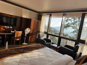Ένα ή περισσότερα κρεβάτια σε δωμάτιο στο Hotel Lha-yul nearby MG Road Gangtok