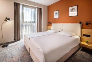 Postel nebo postele na pokoji v ubytování B1 Downtown Hotel