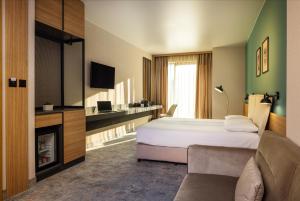 TV a/nebo společenská místnost v ubytování B1 Downtown Hotel