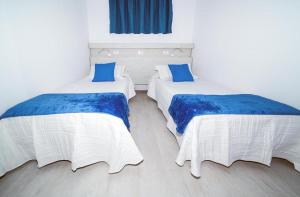 Postel nebo postele na pokoji v ubytování Apartamentos Monte Verde