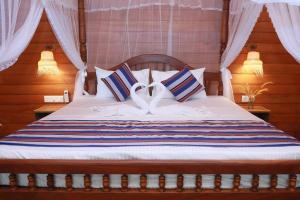 Postel nebo postele na pokoji v ubytování Oasis cabanas