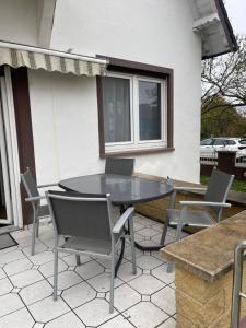 a table and chairs sitting on a patio at Projektunterkunft Wörth nähe MIRO - Mercedes Benz - Dachser in Wörth am Rhein