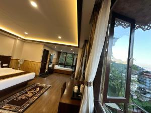 Ένα ή περισσότερα κρεβάτια σε δωμάτιο στο Hotel Lha-yul nearby MG Road Gangtok