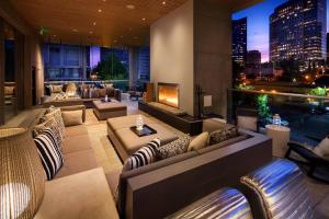 a hotel lobby with couches and a fireplace at W Bellevue in Bellevue