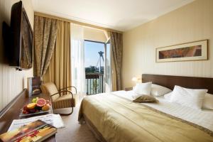 Postel nebo postele na pokoji v ubytování Hotel Devín