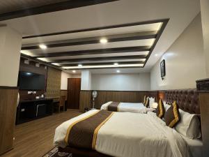 Μια τηλεόραση ή/και κέντρο ψυχαγωγίας στο Hotel Lha-yul nearby MG Road Gangtok