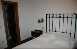 Postel nebo postele na pokoji v ubytování La Casa Del Reloj