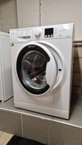 a white washing machine sitting on top of a counter at Ferienhaus im Moor in Wiesmoor