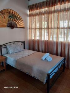 Postel nebo postele na pokoji v ubytování Pindos Mountain View Rooms