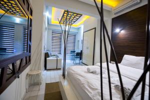 Postel nebo postele na pokoji v ubytování Element Suites