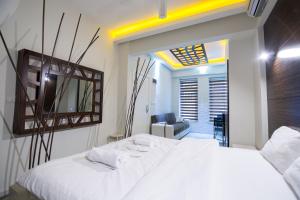 Postel nebo postele na pokoji v ubytování Element Suites