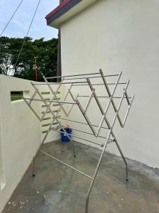 a metal structure sitting on the side of a building at Allbes Klang Room in Klang