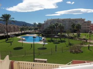 a view of a park with a pool and buildings at Playa Sol Mediterranea in Denia