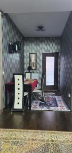 a living room with a table and a desk at Apartament Anahita in Sinaia