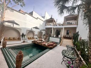 a house with a swimming pool in front of it at Dar Salam Souss in Taroudant