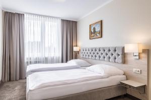 Postel nebo postele na pokoji v ubytování Hotel Podlasie