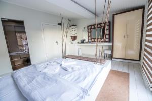 Postel nebo postele na pokoji v ubytování Element Suites