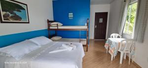 Postel nebo postele na pokoji v ubytování Suítes Encanto do Pai