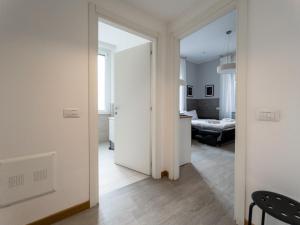 Postel nebo postele na pokoji v ubytování RRRapido Holy Suites and Rooms - Via Sardegna