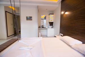 Postel nebo postele na pokoji v ubytování Element Suites
