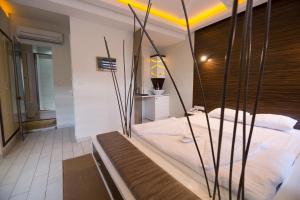 Postel nebo postele na pokoji v ubytování Element Suites