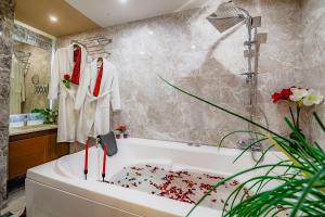 a bathroom with a bath tub and a sink at Lord Morgan & Exclusive Design Cihangir in Istanbul