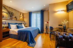 a hotel room with a bed and a table and chairs at Lord Morgan & Exclusive Design Cihangir in Istanbul