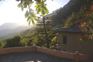 a house with a view of a mountain at Hotel SkyFall in Haputale