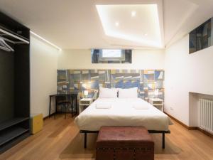 Postel nebo postele na pokoji v ubytování RRRapido Holy Suites and Rooms - Via Sardegna