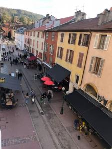 a group of people walking down a street with buildings at La petite Venise des Alpes, Ultra centre 1 à 5 Pers in Annecy