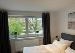Ένα ή περισσότερα κρεβάτια σε δωμάτιο στο Apartment am Berliner Platz
