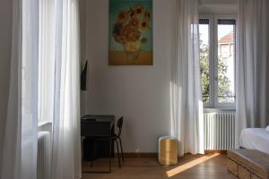Postel nebo postele na pokoji v ubytování RRRapido Holy Suites and Rooms - Via Sardegna